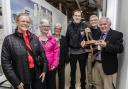 Beverly Brown, Ann Latham, Kathie Arundell, Mark Latham, James Lindop Brown and Stephen Nunn, holding Captain Brown's Sam Browne belt