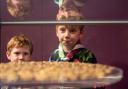 Two children admire the coins on display
