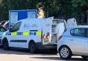 Working - a forensic van with investigators at a Lidl in Braintree