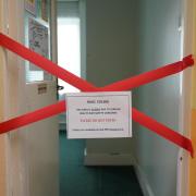 Closed - an illustrative photo of a room taped off inside Parks Primary School in Leicester